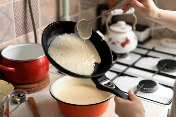 Making Pancakes on frying pan. Making Crepes on frying pan.