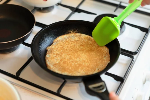 Making Pancakes on frying pan. Making Crepes on frying pan.