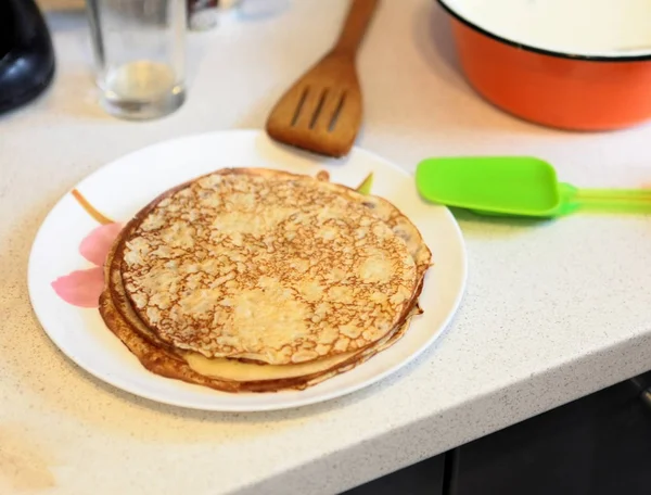 Making Pancakes on frying pan. Making Crepes on frying pan.