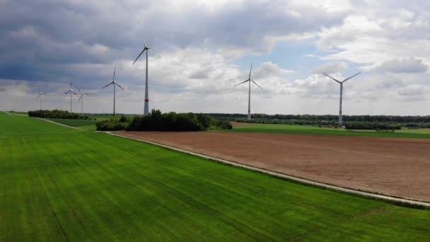 Aerial flight over wind power plants - wind energy mills from above — Stock Video