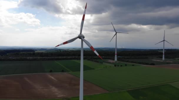Aerial flight over wind power plants - wind energy mills from above — Stock Video