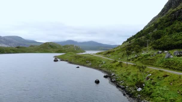 Flight over small lakes and creeks in the highlands of Scotland — Stock Video