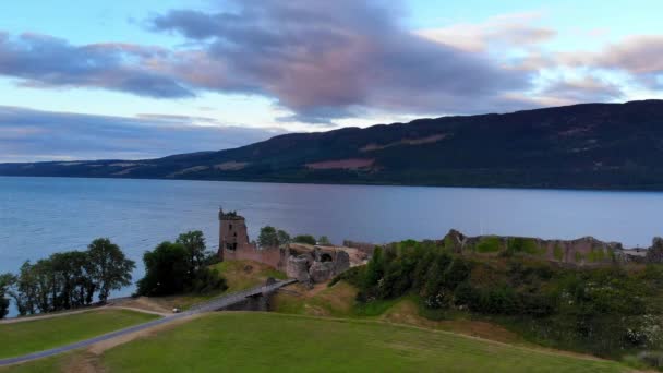 Loch Ness and Urquhart Castle in the evening - aerial drone footage