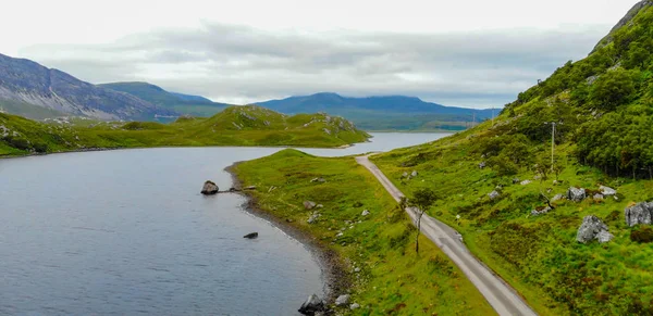 Aerial view over small lakes and creeks in the highlands of Scotland — Stock Photo, Image