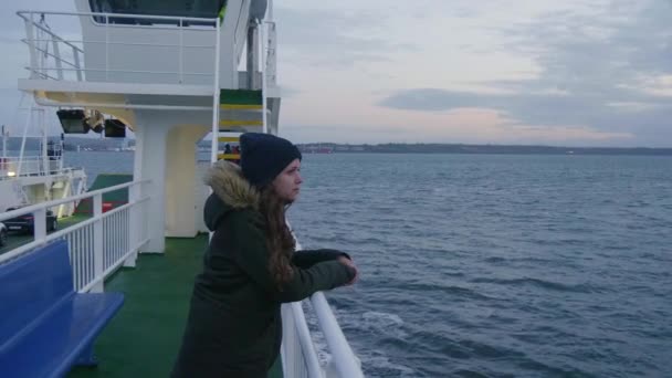 Girl leans on the reeling of a ferry — Stock Video