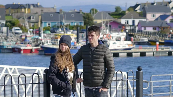 Young couple enjoys the sightseeing trip through Dingle Ireland