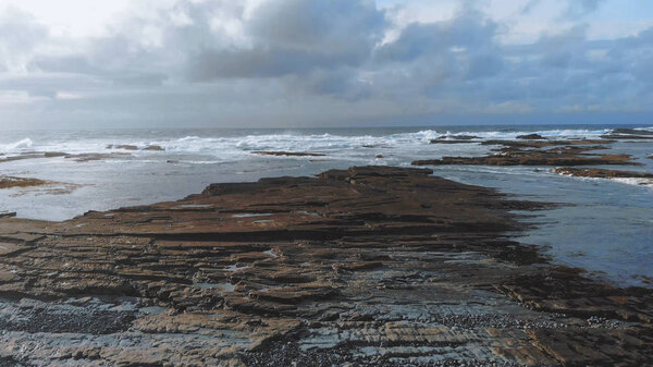 Low Aerial view over the rocky west coast of Ireland