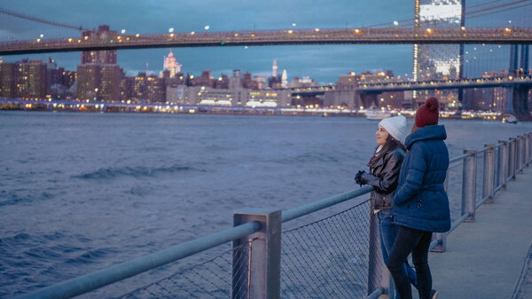 Relaxing at the Hudson River New York with a beautiful evening view over Manhattan city lights - travel photography