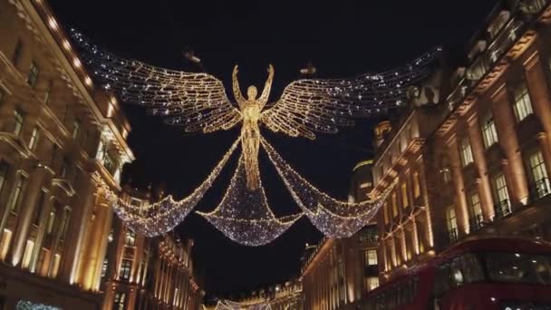 Christmas at London Regent Street with its wonderful angels of Light - LONDON, ENGLAND - DECEMBER 16, 2018 — Stock Video