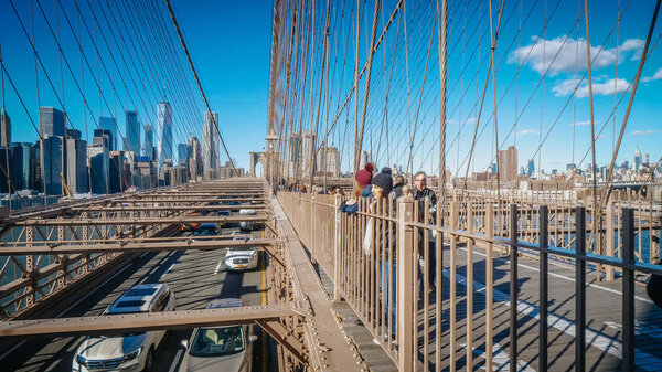 A walk with a view over famous Brooklyn Bridge New York - NEW YORK, UNITED STATES - DECEMBER 4, 2018