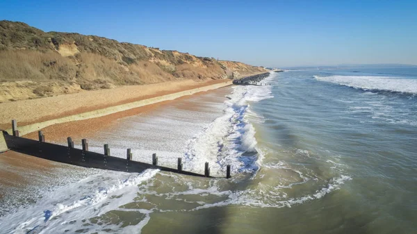 Aerial view over a typical south coast in England with its colorful huts — Stock Photo, Image