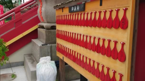 Wishes written on wooden plates in a Buddhist Temple in Japan — Stock Video