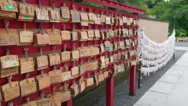 Wishes written on wooden plates in a Buddhist Temple in Japan — Stock Video