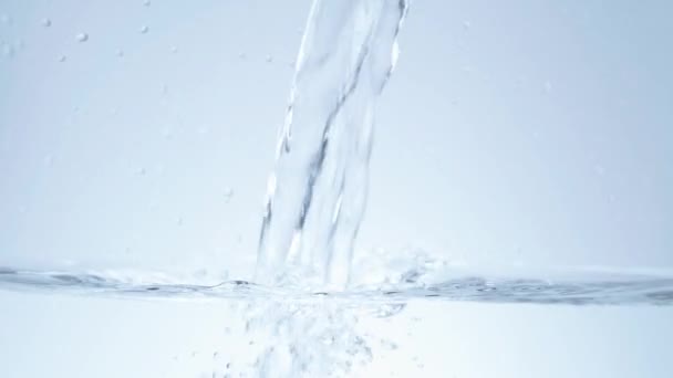 Pouring crystal clear water in slow motion — Stock Video