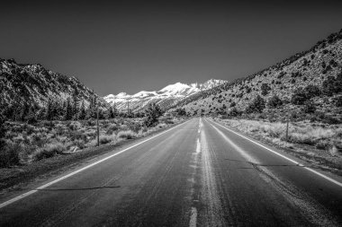 Scenic road through the mountains of Sierra Nevada clipart