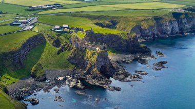 Flight around Dunluce Castle in North Ireland - travel photography clipart