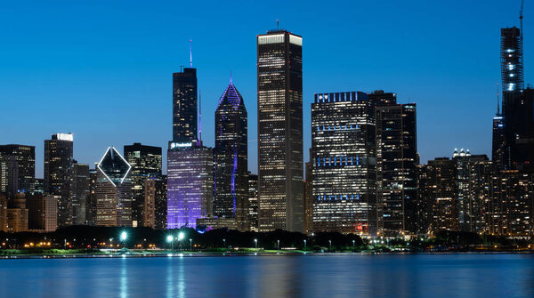 The citylights of Chicago Skyline in the evening - CHICAGO, ILLINOIS - JUNE 12, 2019