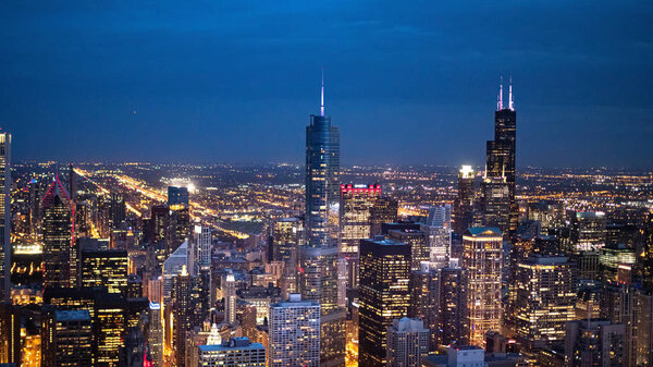 Chicago by night - amazing aerial view over the skyscrapers - CHICAGO, ILLINOIS - JUNE 12, 2019