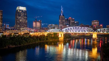 The skyline of Nashville at night - NASHVILLE, TENNESSEE - JUNE 15, 2019 clipart