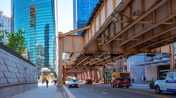 Typical street view in Chicago with subway tracks - CHICAGO, ILLINOIS - JUNE 11, 2019