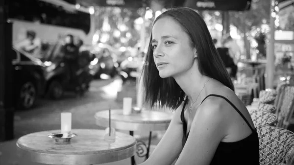 French girl at a street cafe in Paris - Paris street photography