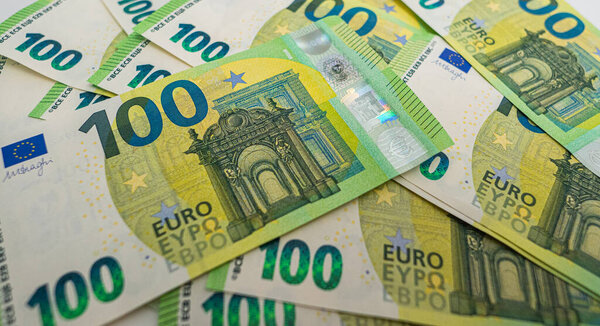 100 Euro bills on a white background. High quality photo