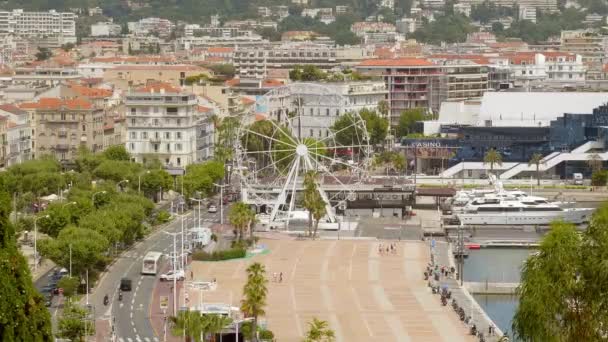 Ferris wheel and Casino of Cannes — Stock Video