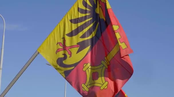 Flags of Switzerland and the City of Geneva on a bridge in Geneva - GENEVA, SWITZERLAND - JULY 8, 2020 — Stock Video