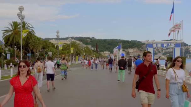 The promenade in Nice is a popular place in summer - CITY OF NICE, France - JULY 10, 2020 — стоковое видео
