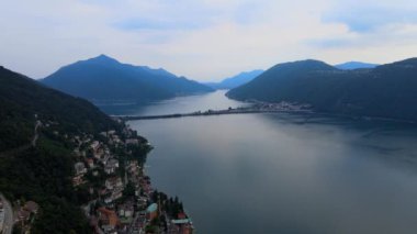 İsviçre 'deki Lugano Gölü üzerinde hava manzarası - akşam manzarası