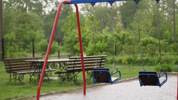 Empty Swing Drenches In The Rain Swaying In Wind A Heavy Rain A Thunderstorm A Downpour With A Strong Wind Swing On Playground Covered By Rain During Rainy Day