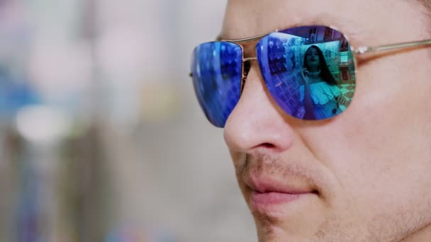 Close Portrait Man Blue Sunglasses Optical Store Spectacles Reflected Showcase — Stock Video