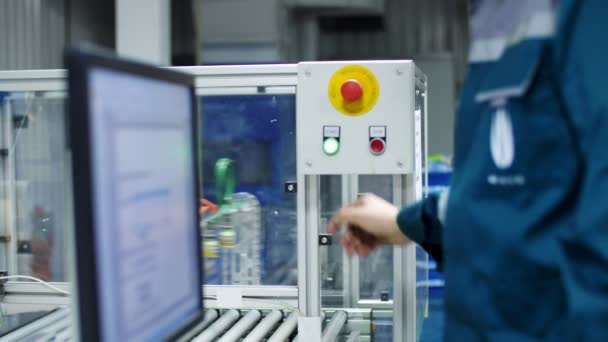 CHERKASY, UKRAINE - AUGUST 24, 2018: close-up, on special shield,hand presses green start button. printing process of printing packages for grain, agricultural products. production, in the workshop, — Stock Video