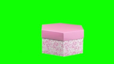 Güzel bir hediye kutusu, yeşil arka planda izole edilmiş. Yakın çekim, rotasyon. neşeli ambalaj.