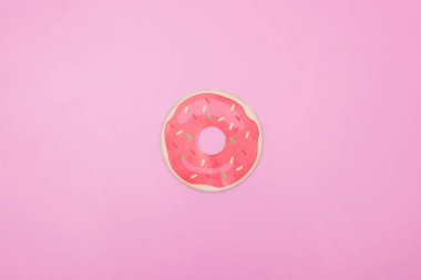 Bir örnek bir donut pembe bir arka plan üzerinde fotoğrafı