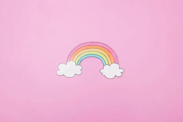 illustration photo of a rainbow and clouds on pink background