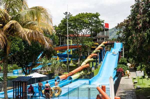 Water park, pool area with slides on a sunny day
