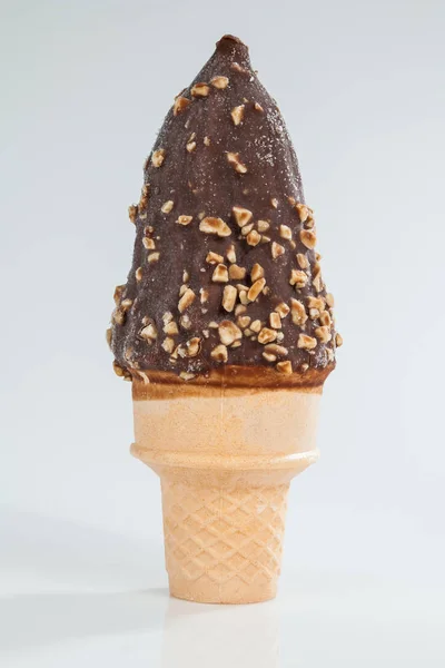 ice cream with chocolate coating and pieces of peanuts