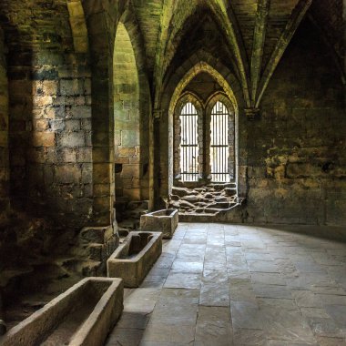 England, West Yorkshire, Leeds, North Bank of river Aire. Kirkstall Abbey, 12th century Cistercian Monastery ruins. clipart