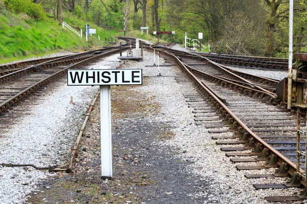 England, West Yorkshire. Keighley and Worth Valley Railway, steam trains, 5-miles up Worth Valley to Haworth and Oxenhope. Sign.