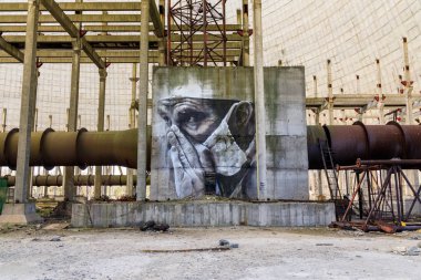 Eastern Europe, Ukraine, Pripyat, Chernobyl. April 10, 2018. Inside the unfinished cooling tower, a mural depicts a tired doctor. Painted by Australian artist Guido van Helton in 2016 based on a photograph by Igor Kostin.  clipart