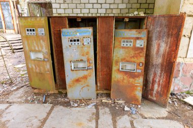 Eastern Europe, Ukraine, Pripyat, Chernobyl. Rusted soft drink dispensers. April 11, 2018. clipart