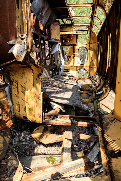 Eastern Europe, Ukraine, Pripyat, Chernobyl. Inside rusted overturned school bus.