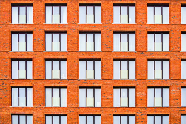 Brickwork facade of a residential building in the loft style. Modern buildings of St. Petersburg.