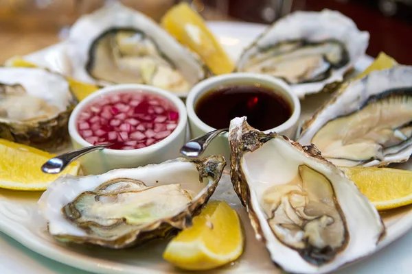 Oysters on a plate with lemon.  close-up view