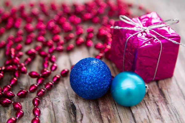 New Year Composition Two Blue Balls Gift Table Red Beads — Stock Photo, Image