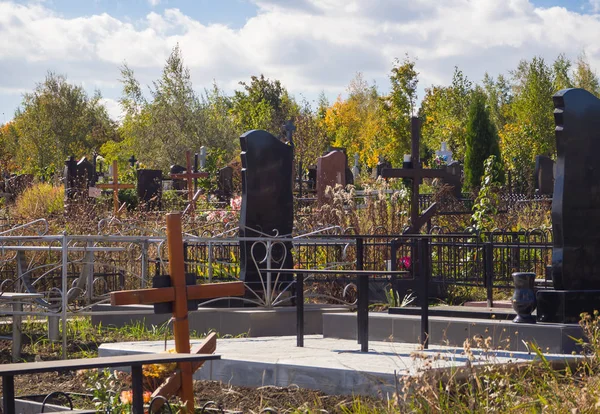 City cemetery in autumn. Current urban burial.