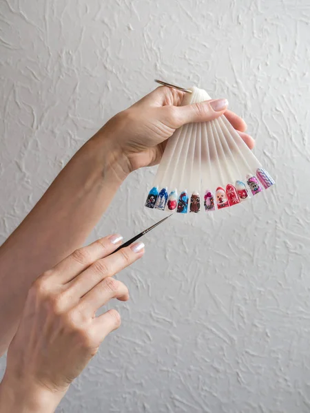 Drawings on the nails. Manicure design concept.