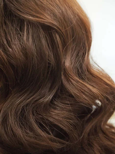 Brown curls of hair, female hairstyles. Close up. — Stock Photo, Image