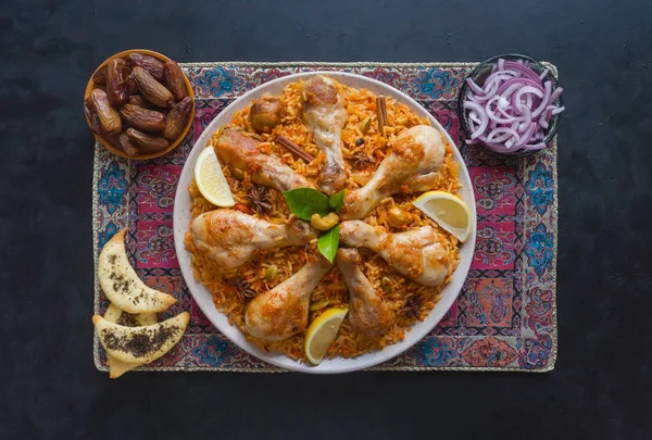 Chicken Mandi with dates. Arabic cuisine. Top view